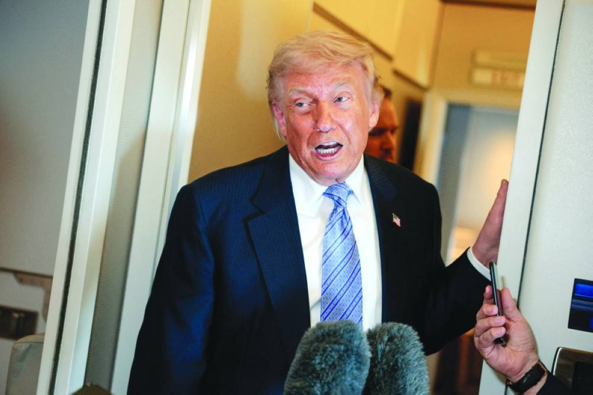 US President Donald Trump speaks to the press aboard Air Force One enroute to the US following his official visit with President Xi Jinping in China, May 15, 2026. REUTERS/File picture