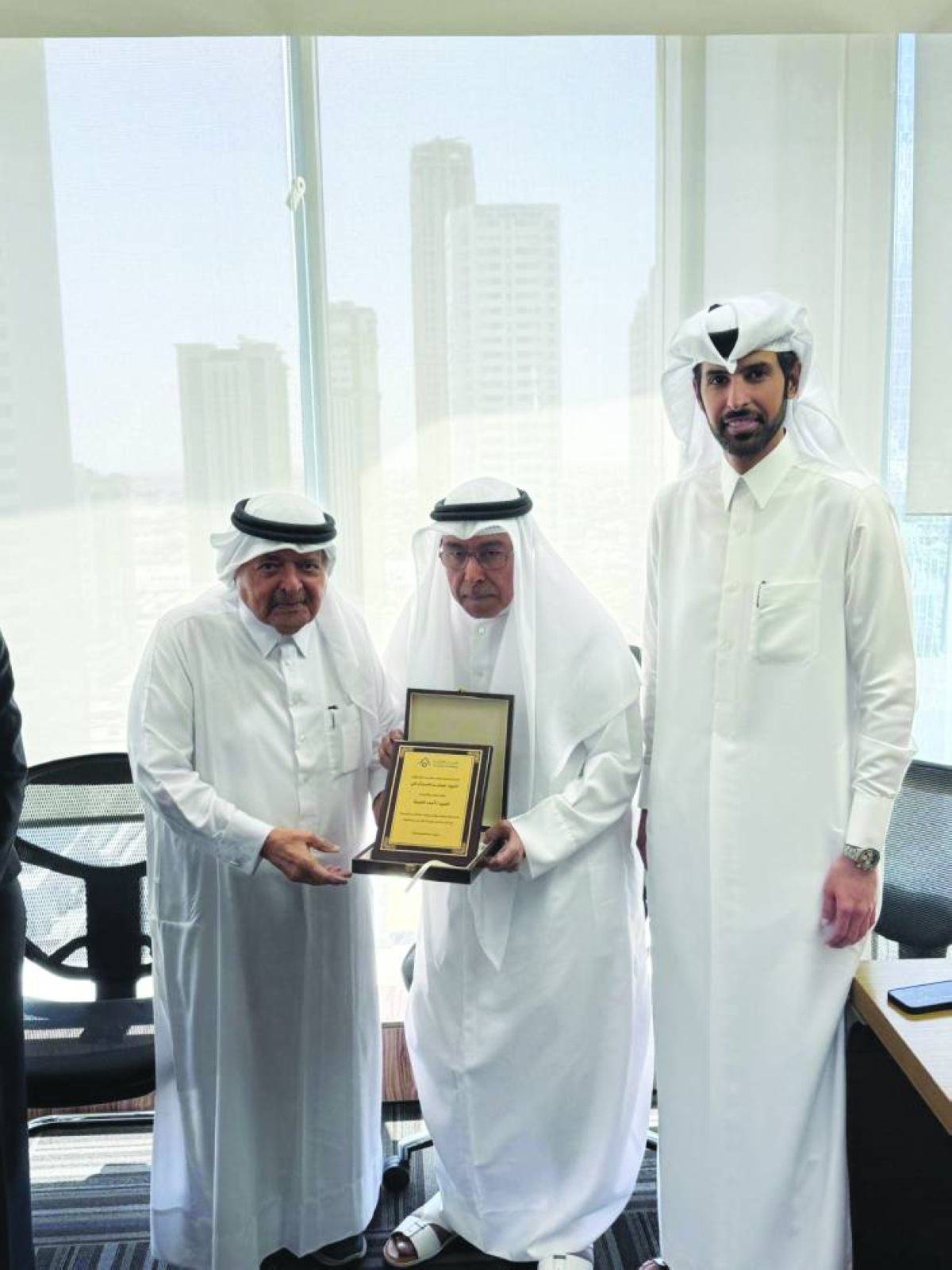 His Excellency Sheikh Faisal bin Qassim al-Thani, Ahmed al-Neama, and His Excellency Sheikh Mohammed bin Faisal al-Thani at the honouring ceremony.