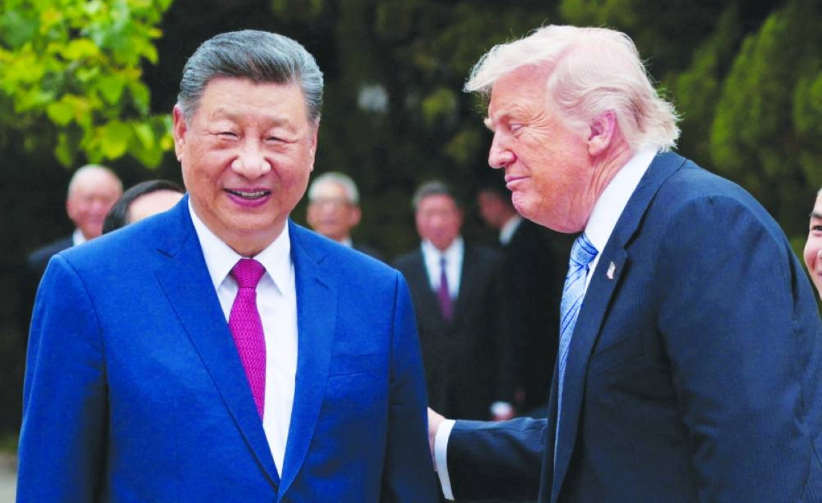 
US President Donald Trump speaks with Chinese President Xi Jinping while leaving after a visit to the Zhongnanhai Garden in Beijing on Friday. (Reuters) 