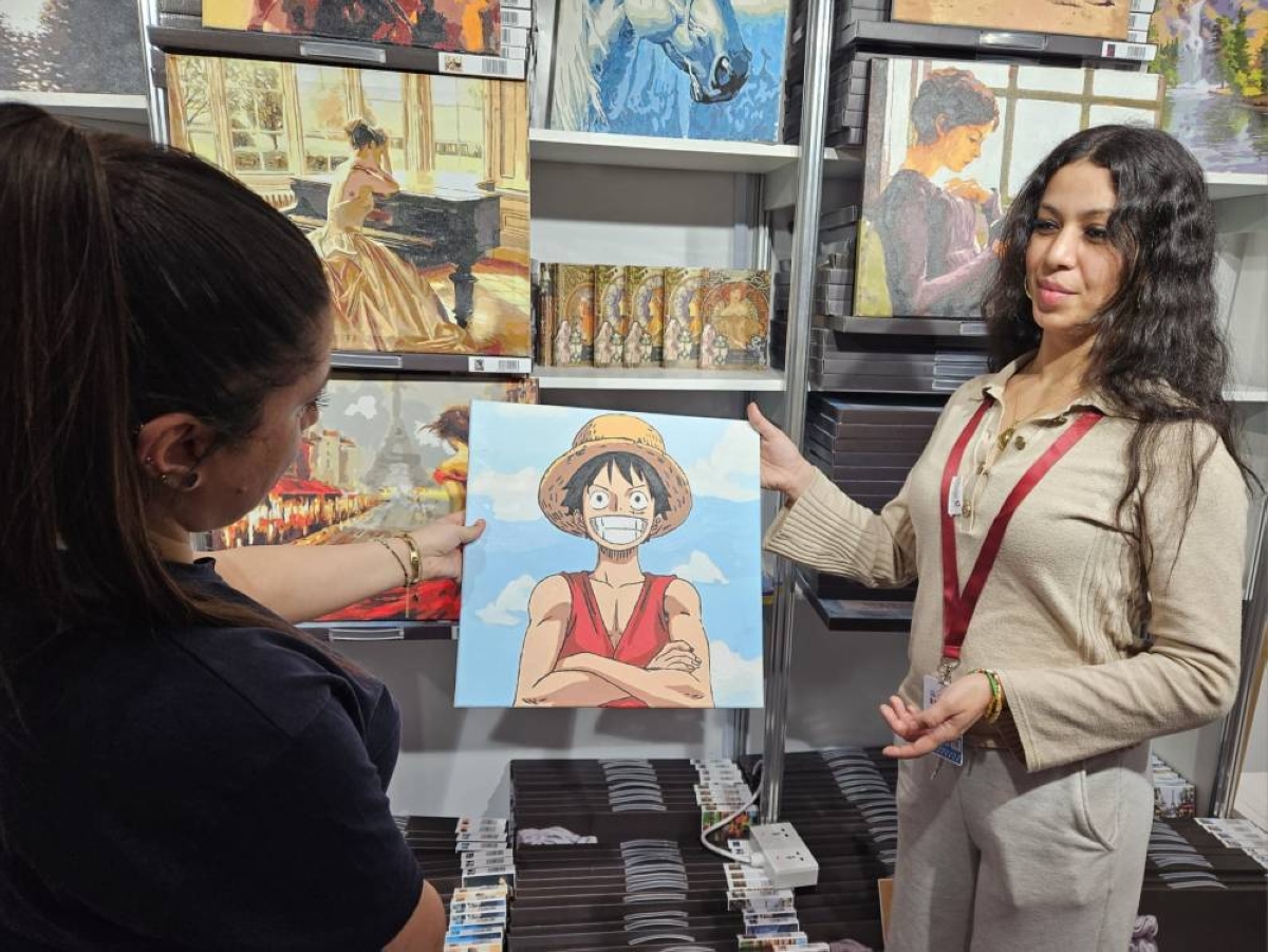 Houda's stall draws a wide range of customers with kits featuring characters from popular Japanese manga and anime alongside classical paintings.