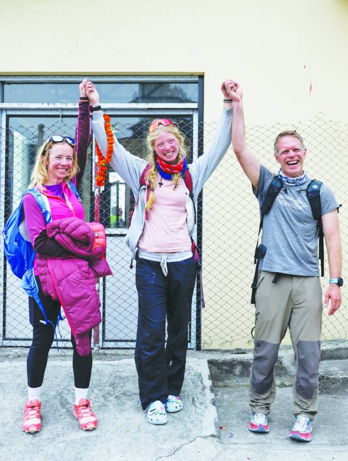 Bianca Adler, 18, who claims to be the youngest Australian to climb Mount Everest, poses for a picture along with her mother Fiona Adler and father Paul Adler, upon her arrival after climbing Mount Everest in Kathmandu, Thursday. (Reuters)