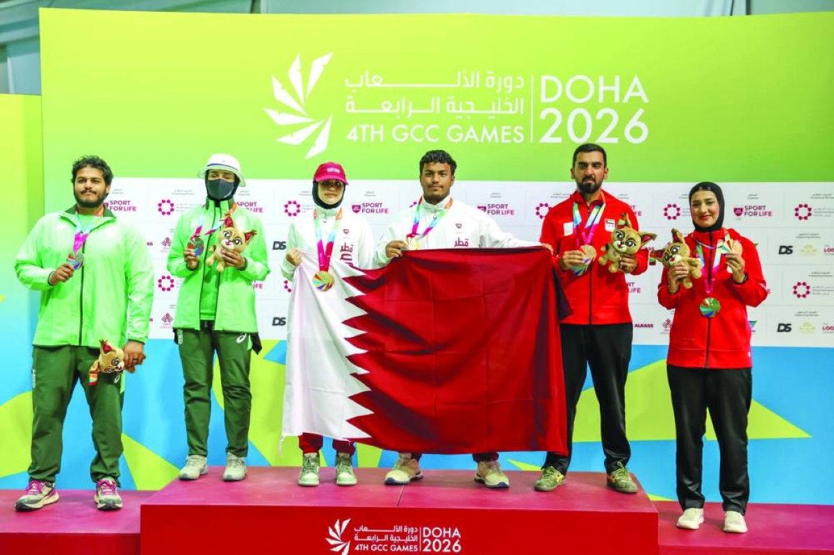 Archers Ahmed al-Sada and Reem al-Saei of Qatar celebrate on the podium after winning gold in the recurve mixed team event at the GCC Games at Lusail Shooting Range on Thursday.