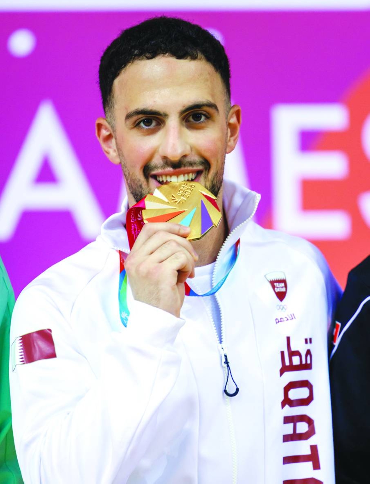 Qatar’s Yaman Ashraf poses after winning karate gold in under-67kg category at the GCC Games on Thursday.