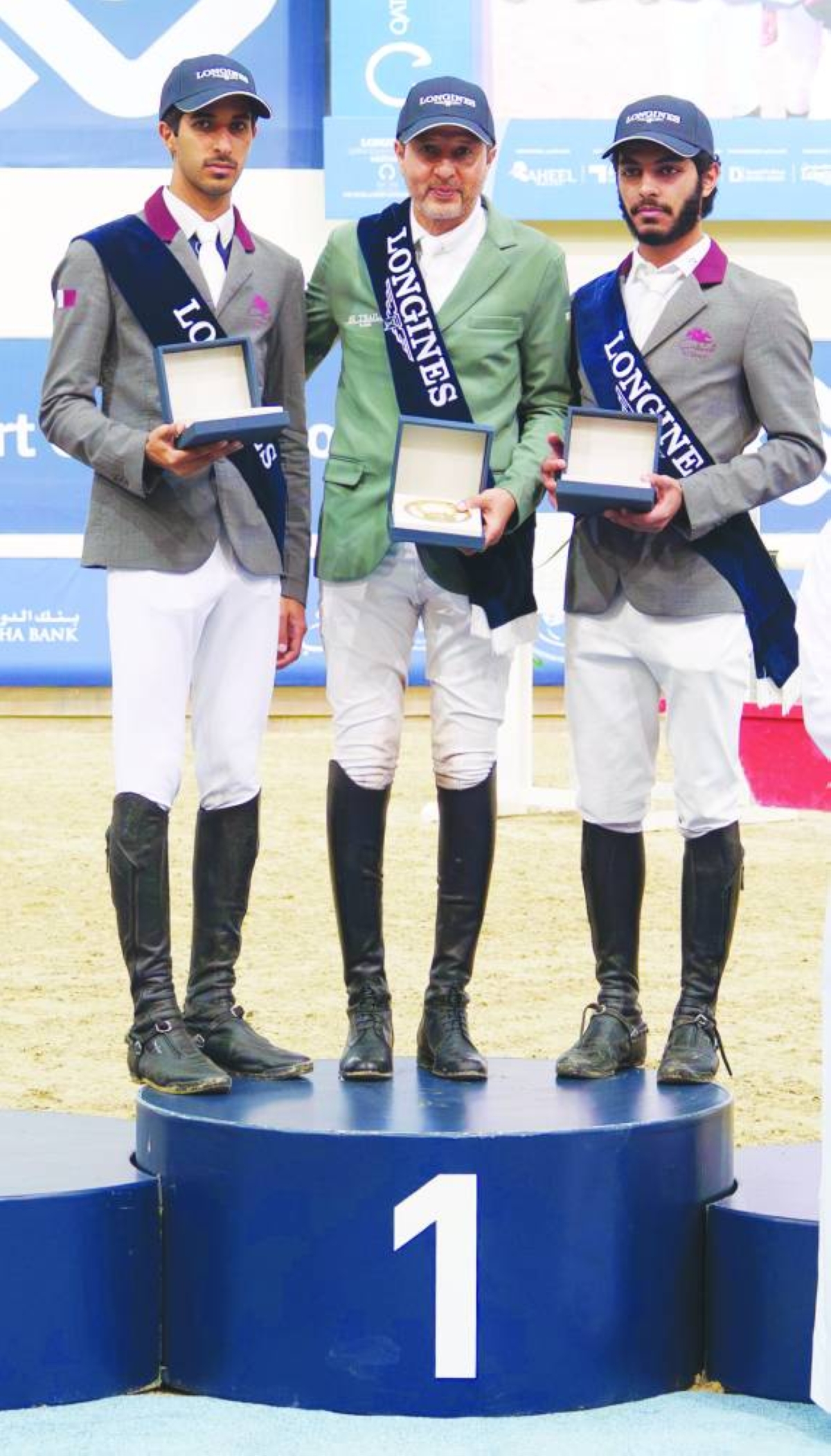 Gold Tour winner Khaled al-Eid of Saudi Arabia poses with runner-up Faris Saad al-Qahtani of Qatar and his compatriot third-placed Sultan Salem al-Naemi.