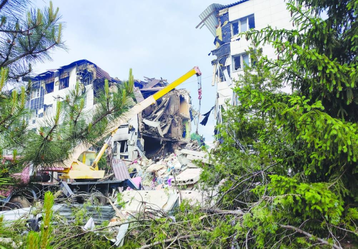 Rescuers work amid debris of a destroyed dormitory building of the Starobilsk College of Luhansk Pedagogical University following an overnight attack, what Russian-installed authorities called a Ukrainian drone strike, in the course of the Russia-Ukraine conflict in the town of Starobilsk (Starobelsk) in the Luhansk region, a Russian-controlled area of Ukraine, May 22, 2026. Picture taken with a mobile phone. REUTERS/Pavel Klimov