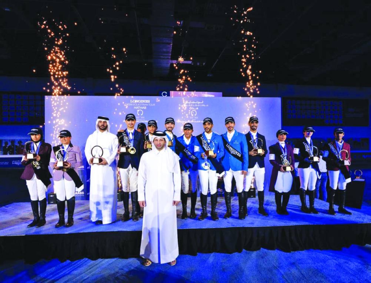 Sheikh Ahmad bin Nooh al-Thani, Secretary-General of the Qatar Equestrian Federation and Chairman of the Championship Organizing Committee, with overall champions of various categories of of Qatar Equestrian Tour - Longines Hathab at QEF's indoor arena on Saturday.