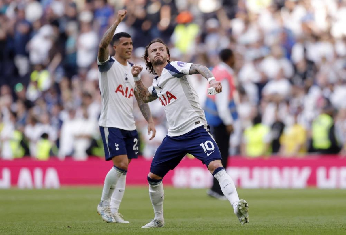 Tottenham Hotspur's James Maddison celebrates after the win over Everton secured Spurs' Premier League survival in London. (Reuters)