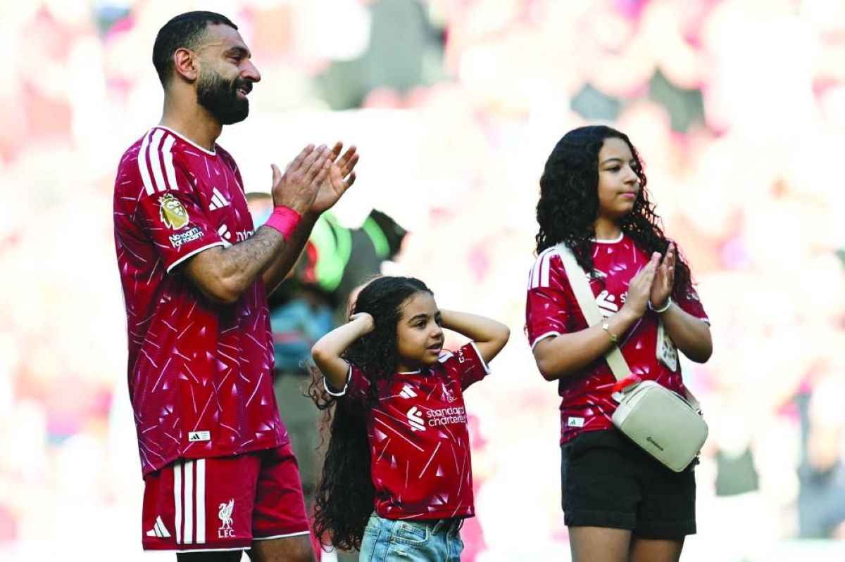 Mohamed Salah with his daughters after playing his final match for Liverpool on Sunday. (AFP)