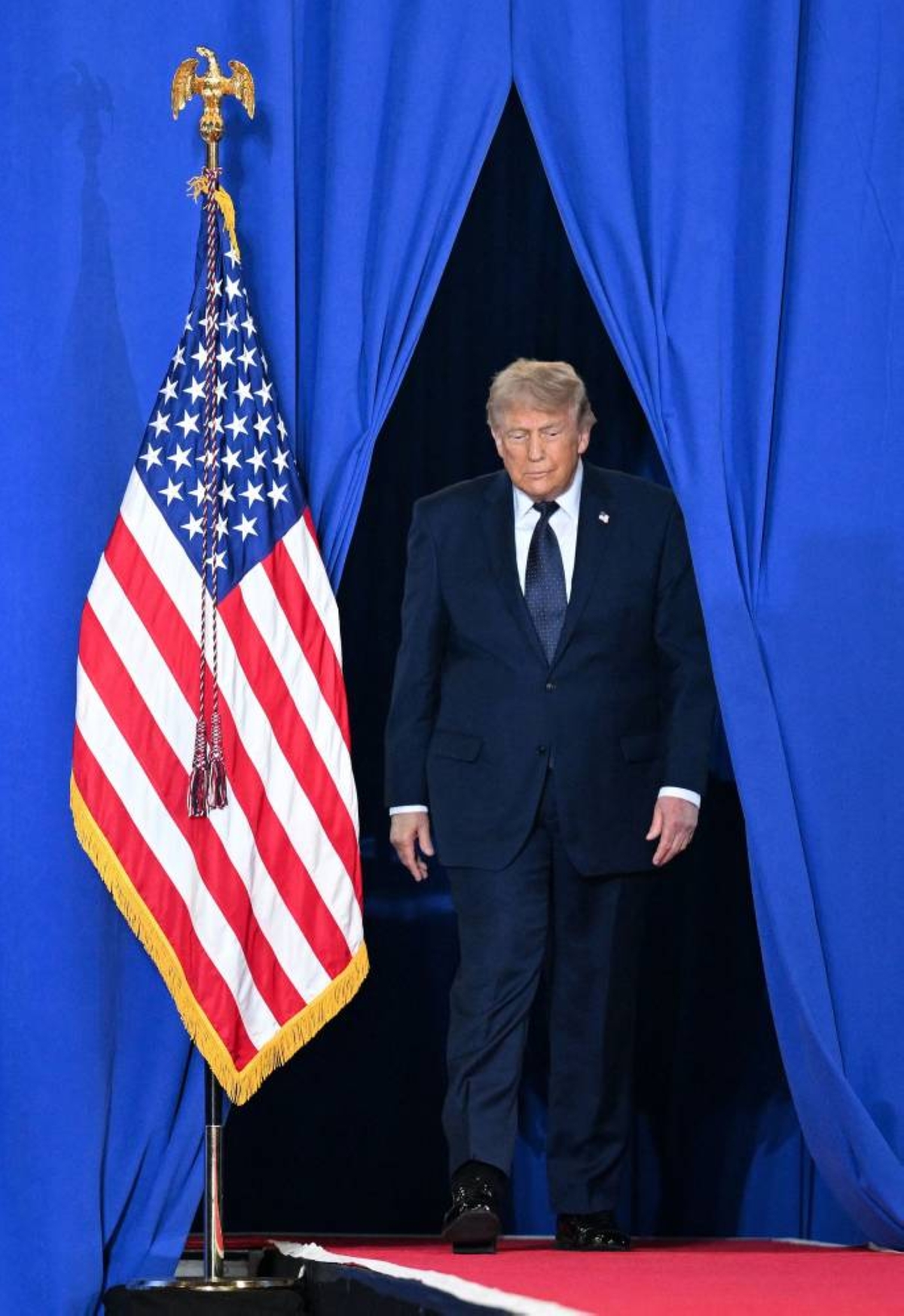 US President Donald Trump arrives to deliver remarks during a campaign and economic policy event in the Eugene Levy Fieldhouse, New York. 
AFP/File picture
