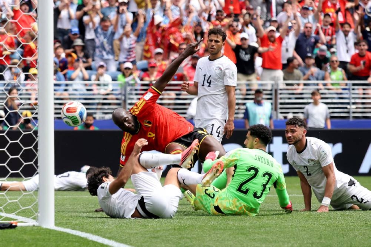 Belgium escape Egypt upset bid with own goal