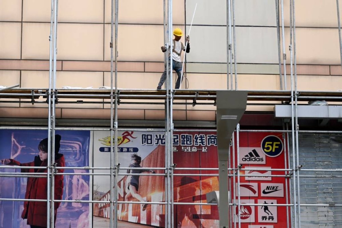 China's Q2 economic growth cools to 3-1/2-year low as imbalances worsen