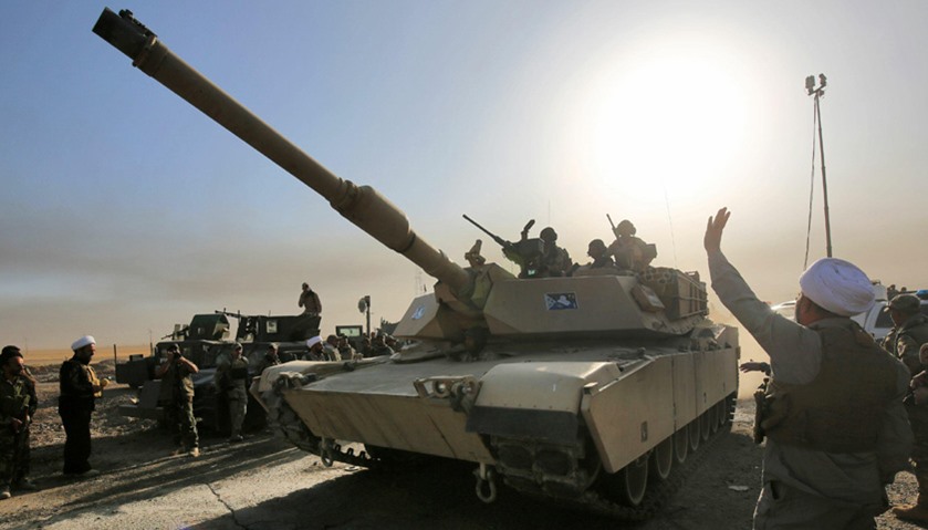 Iraqi forces deploy in the area of al-Shourah, some 45 kms south of Mosul