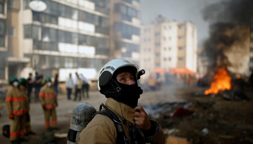 A firefighter takes part in a large-scale earthquake simulation exercise in Seoul