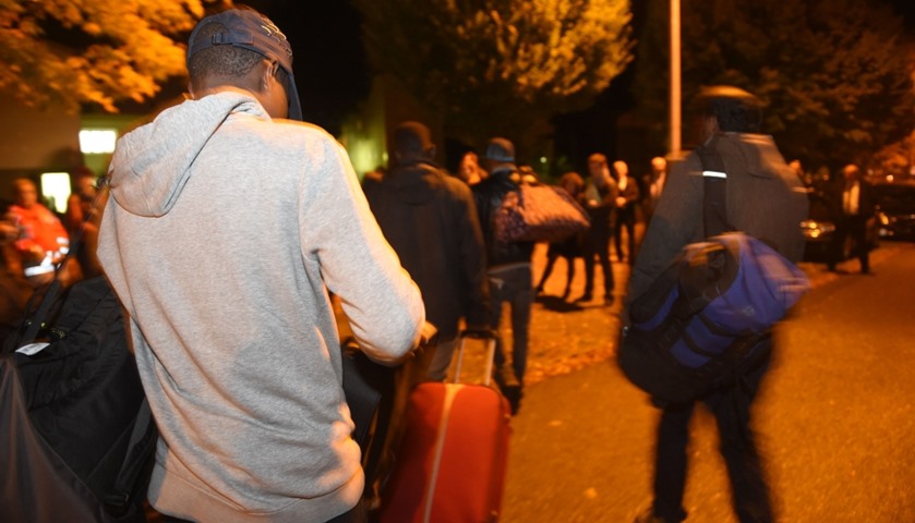 Migrants of Calais arrive at an orientation facility in Nogent-le-Rotrou, France