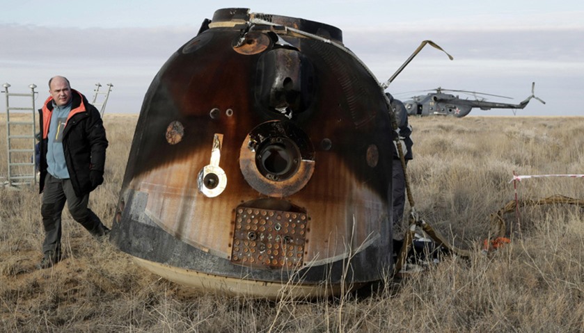 A Russian Soyuz MS space capsule rests on the ground after landing