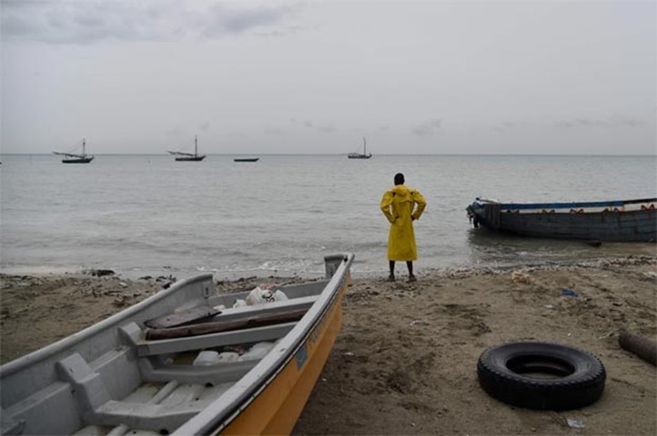 A fisherman looks at the sea in Caira beach, southwest of Port-au-Prince, Haiti, on Monday