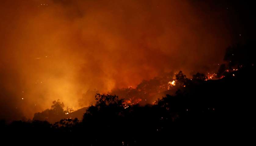 The Pocket wildfire burns in the hills above Geyserville, California