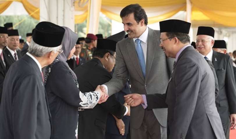 His Highness the Emir shakes hands with the Malaysian official delegation