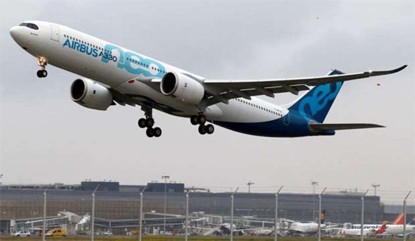 An Airbus A330neo aircraft lands during its maiden flight in Colomiers near Toulouse on Thursday