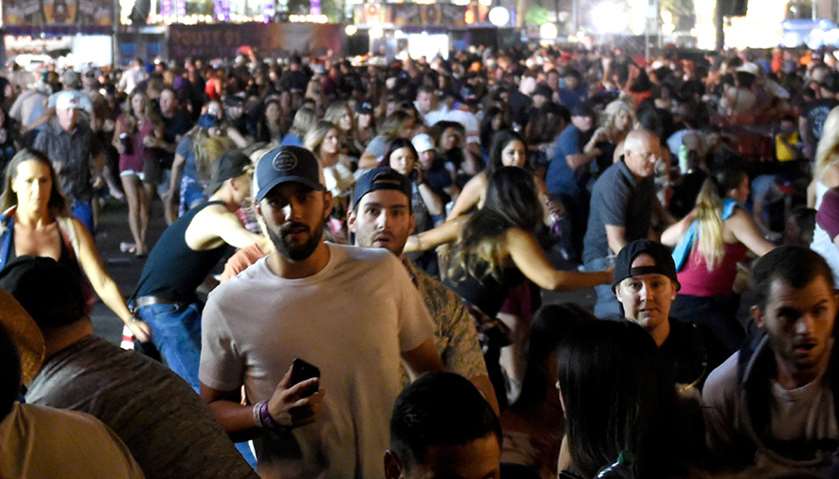 People flee the Route 91 Harvest country music festival grounds