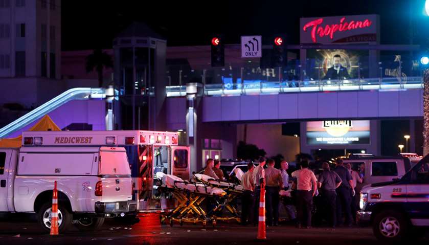 Medical workers stage in the intersection of Tropicana Avenue and Las Vegas Boulevard South after a 