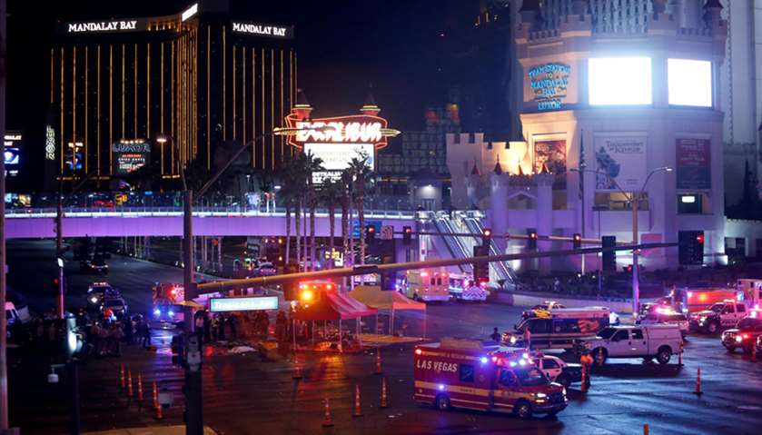 Las Vegas Metro Police and medical workers stage in the intersection after a mass shooting