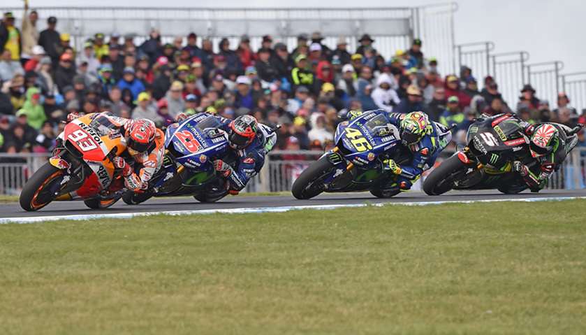 Honda rider Marc Marquez of Spain leads Yamaha rider Maverick Vinales of Spain (2nd L), Yamaha rider