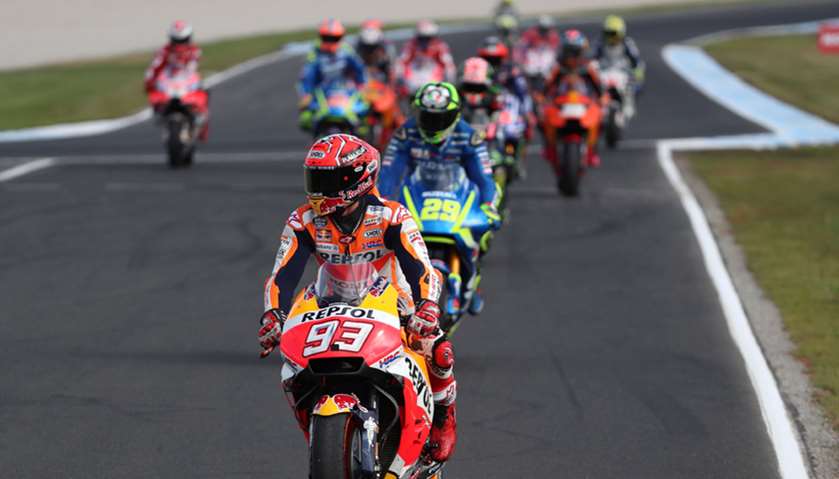 Honda rider Marc Marquez of Spain (front) leaves the track following his victory in the Australian M
