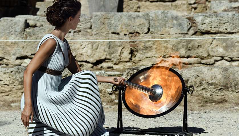 Actress Katerina Lechou acting the high pristess lights the Olympic flame at the Temple of Hera