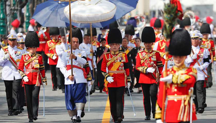 Thailand\'s King Maha Vajiralongkorn (C) marches during the royal cremation procession of late King B