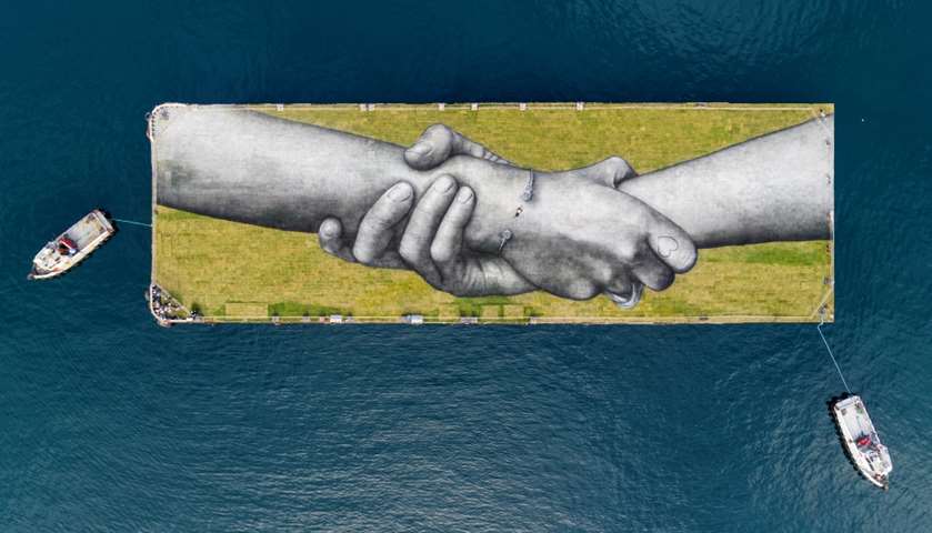 An aerial view that shows a giant land art on a barge, Golden Horn, Istanbul, Turkey