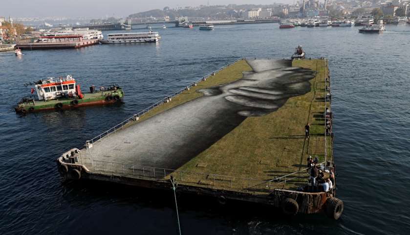 An artwork is seen on a floating barge over the Golden Horn in Istanbul, Turkey