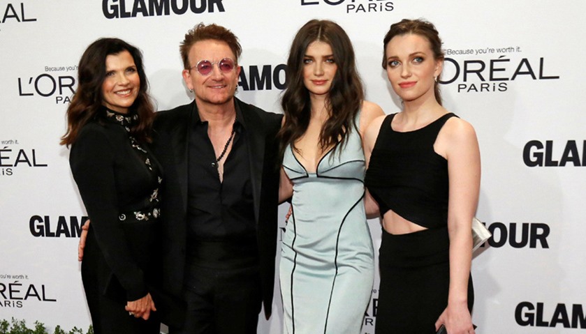Recording artist and honoree Bono of U2 with his wife Ali Hewson (L) and daughters Eve and Jordan (R