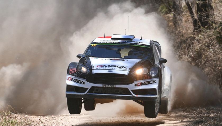 Ottt Tanak of Estonia leaps over a jump in his Ford Fiesta WRC car