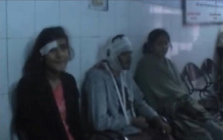 Injured passengers are seen in a hospital after a train derailed in Kanpur district