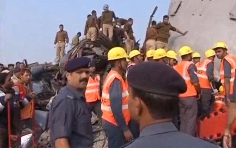 Rescuers at work at the site of the train derailment in Uttar Pradesh