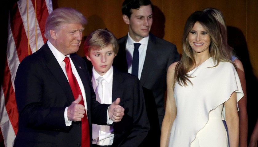 Donald Trump greets supporters along with his wife Melania and family
