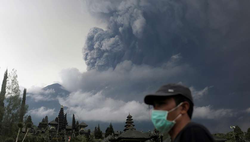 Mount Agung volcano erupts as seen from Besakih Temple in Karangasem, Bali, Indonesia
