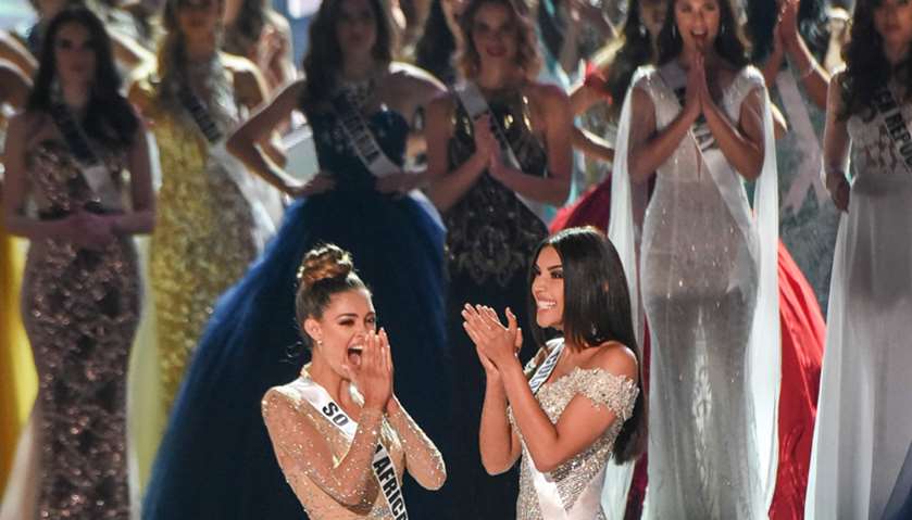 Miss South Africa 2017 Demi-Leigh Nel-Peters (L) reacts to being named a top theee finalist