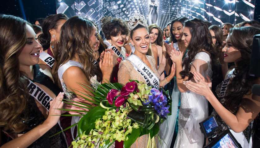 Demi-Leigh Nel-Peters, Miss South Africa 2017 is congratulated by fellow contestants after being cro