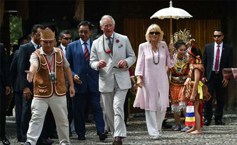Britain\'s Prince Charles and his wife Camilla arrive at the Sarawak Cultural Village in Santubong