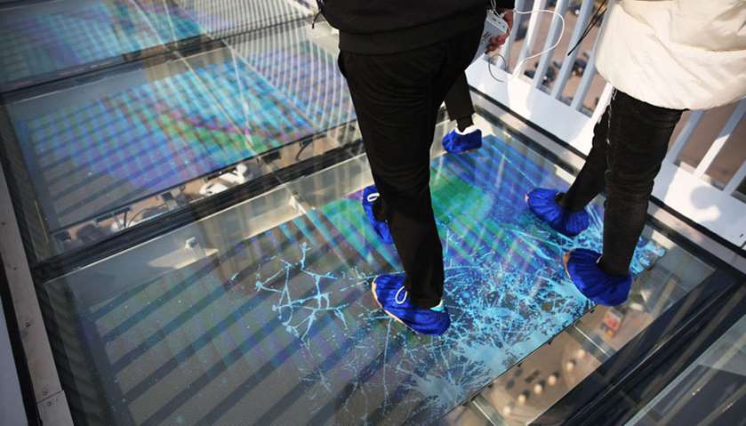 The special effects glass appears to crack when visitors walk on it.