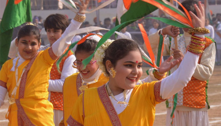Indian school students perform during the celebrations