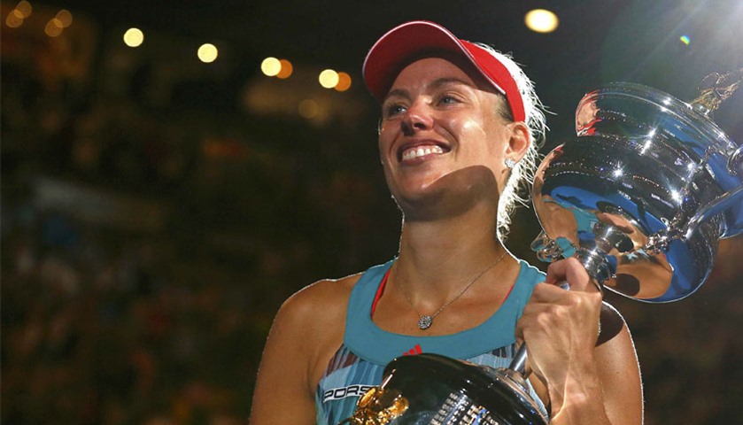 Angelique Kerber celebrates with the trophy after winning