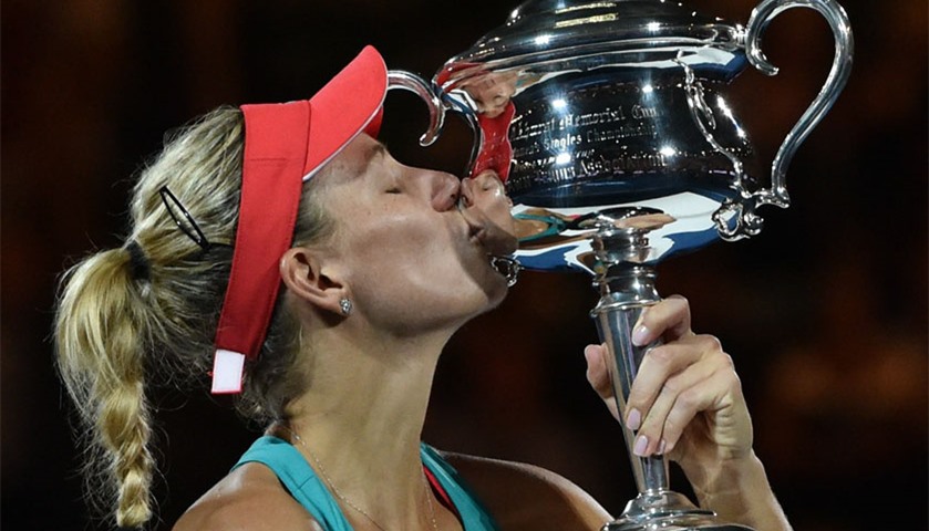 Angelique Kerber kisses The Daphne Akhurst Memorial Cup as she celebrates after victory