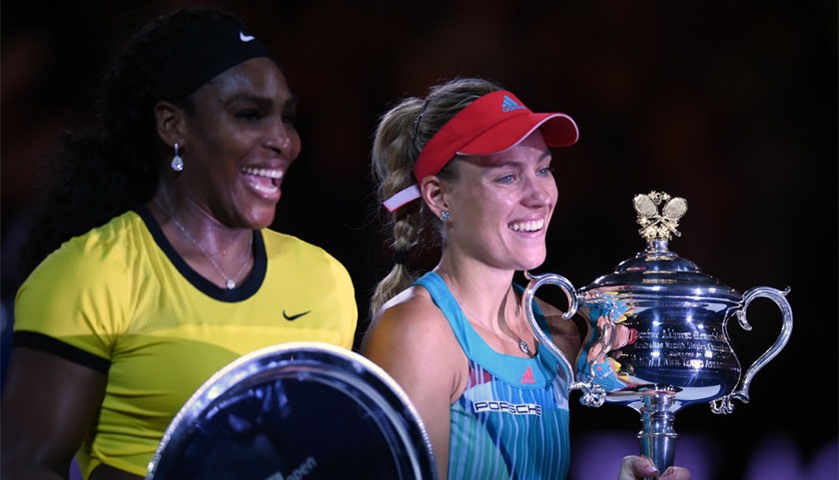 Angelique Kerber (R) holds the Daphne Akhurst Memorial Cup after her victory