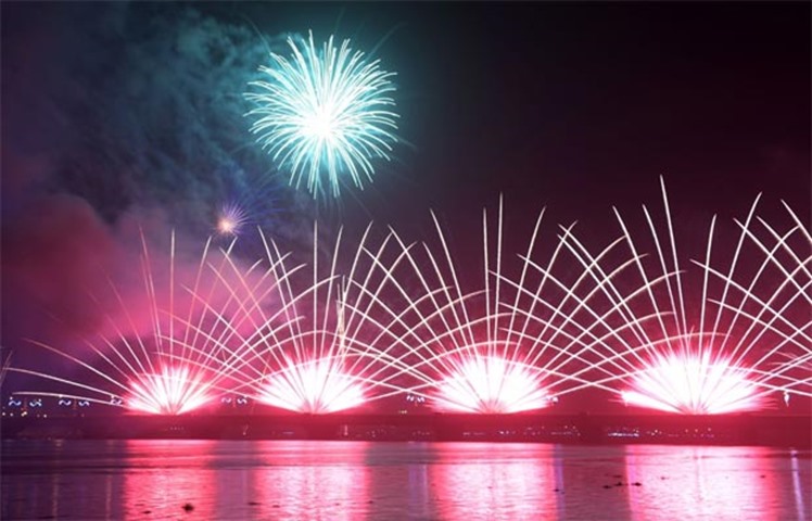 Fireworks over General De Gaulle bridge and the Ebrie lagoon in Abidjan, Ivory Coast