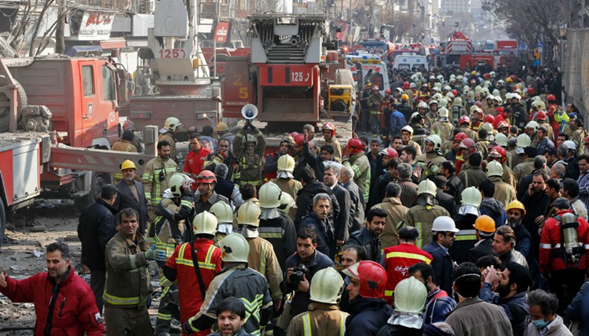 Firefighters work after the collapse of Iran\'s oldest high-rise, the 15-storey Plasco building
