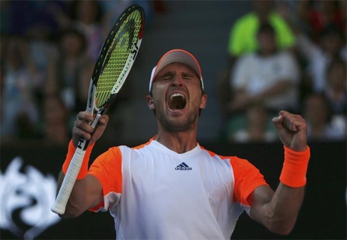 Mischa Zverev celebrates his win against Britain\'s Andy Murray, the top seed at the Australian Open