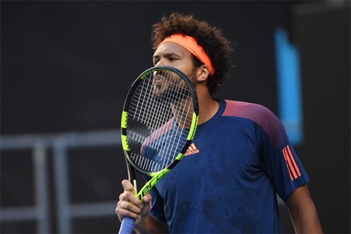 France\'s Jo-Wilfried Tsonga kisses his racquet during his match against Britain\'s Daniel Evans